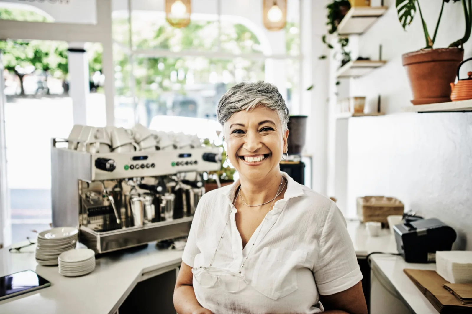 Small-business owner standing in her café